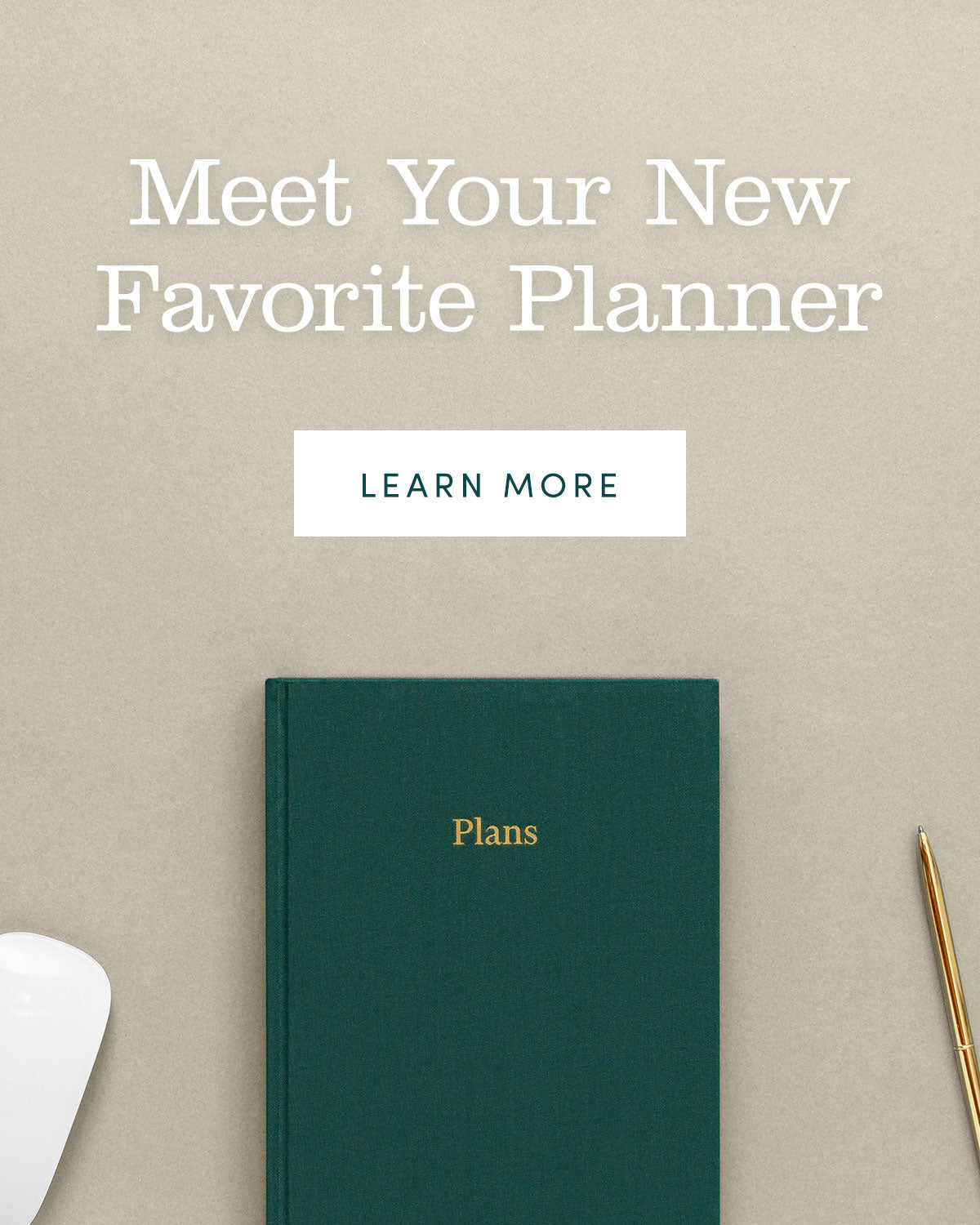 Meet your new favorite planner. Desk scene with mouse, planner, and brass pen.